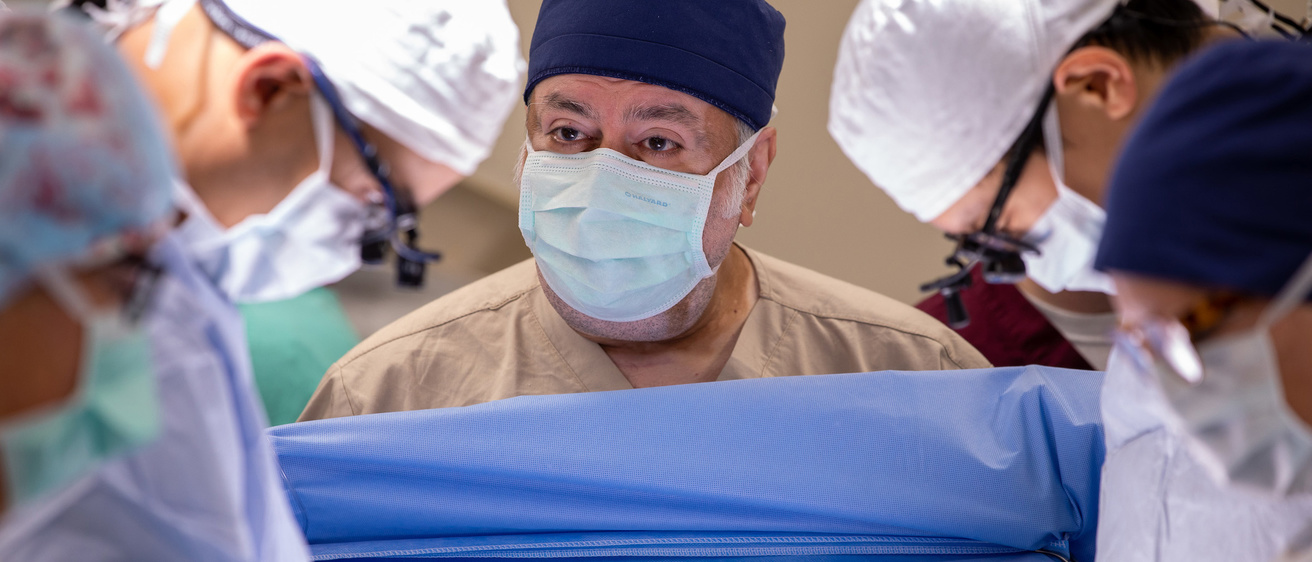 About Us with Bashir looking up during surgery